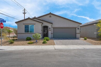 View of front facade with driveway, an attached ga