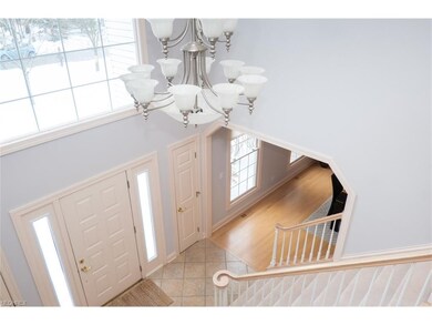 The soaring two-story foyer welcomes you and your 