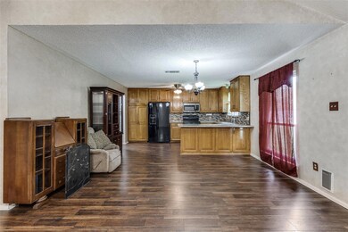 Kitchen with backsplash, dark hardwood / wood-styl