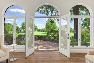 Doorway featuring wood finished floors and golf course view
