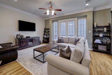 Second floor living room has beautiful oak floors,