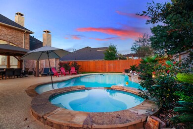 This Pool has plenty room for both swimming laps and playing. Beautiful stone coping, stone tiles, cool decking, water falls, lighting and more.