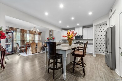 Dining room with a chandelier, sink, and light har