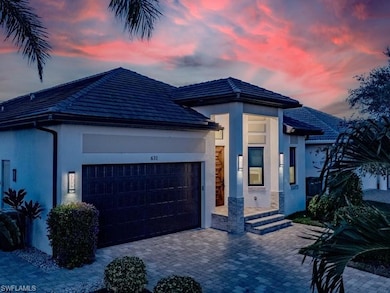 View of front facade featuring a garage