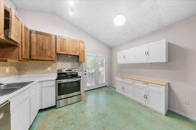 Kitchen with stainless steel appliances, vaulted 