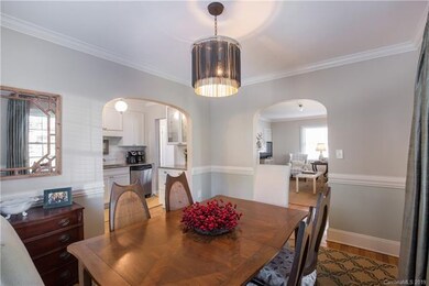 Arched Doorways connect Formal Dining to Kitchen a