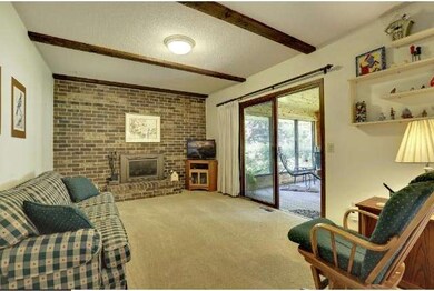 Main level family room with full brick wall firepl