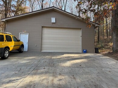 Detached garage with concrete driveway