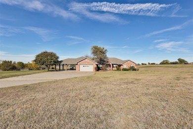 Single story home with an attached garage, drivewa