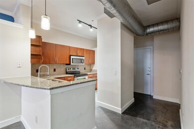 Kitchen with decorative backsplash, hanging light 
