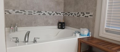 Bathroom featuring a bathtub