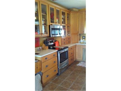 Kitchen boasts stainless steel appliances, hardwoo