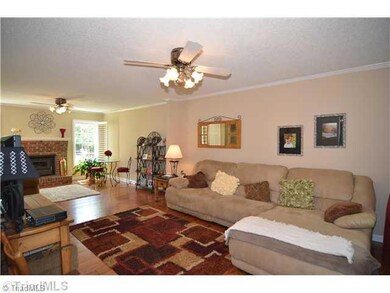 Den/Family/Great Room. This large Great Room has hardwood floors and a cozy fireplace.  It is so large it could be separated into a Great Room and a Sitting Room.
