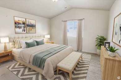 Primary bedroom with lofted ceiling and carpet, ensuite bathroom & walk-in closet