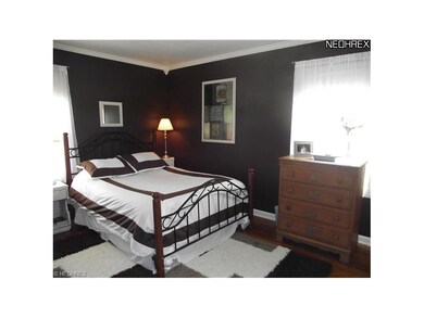 The larger first floor bedroom is currently used as the master.  It features wood floors and his and hers closets.