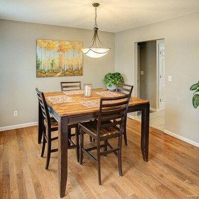 Formal dining room with wood floor