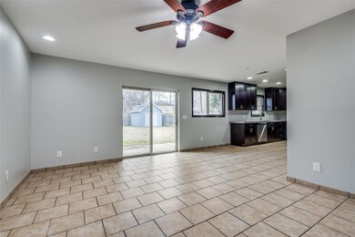 Unfurnished living room with ceiling fan, light ti