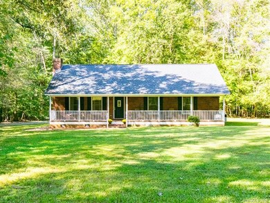 Front of house and spacious front yard.