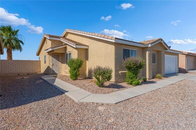 Ranch-style home with stucco siding, a garage, and
