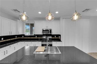 Kitchen with appliances with stainless steel finis