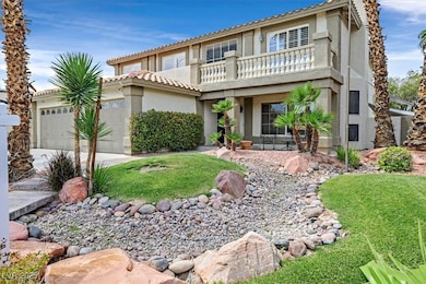 View of front of house with a balcony, a garage, s