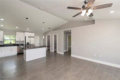 Kitchen featuring a center island, dark countertop