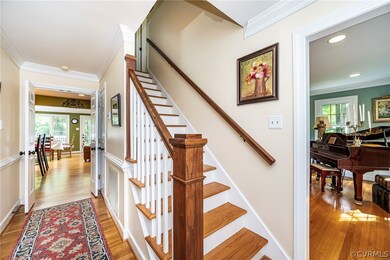 Staircase with light hardwood / wood-style floors
