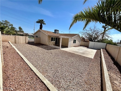 Rear view of house featuring stucco siding, a pati