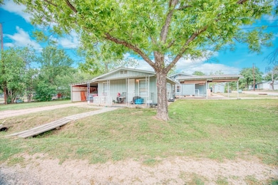 View of front of property with a front lawn and b