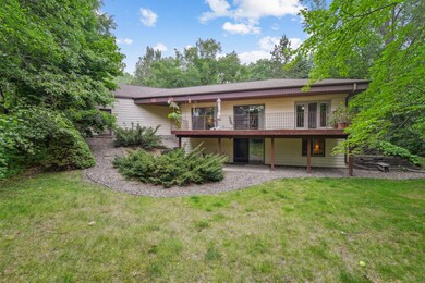 Private backyard with large deck and walkout lower level
