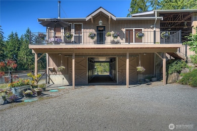 The welcoming and inviting home with daylight basement barn is an equestrian's dream come true!