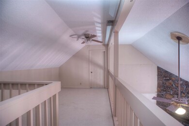 Loft/office overlooking den.