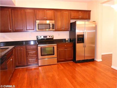 Kitchen - Kitchen showcases new granite counter tops, new raised panel cabinets, new stainless steel range, microwave, dishwaher, and refrigerator.  Hardwoods floor.