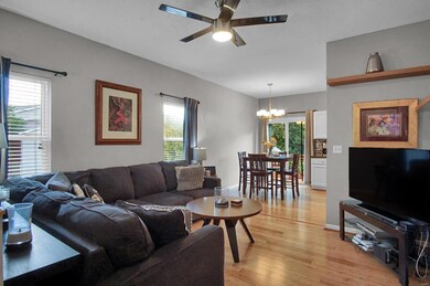 Living room with bamboo floors, that flows into the eat in kitchen and out to the back deck.