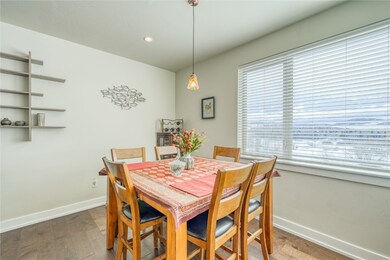 Dining area with baseboards, wood finished floors,