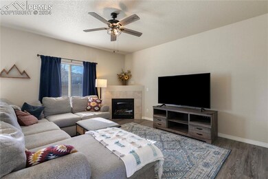 Living room with dark hardwood / wood-style floori