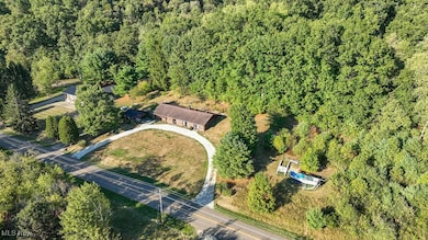 Ariel view of home and wooded area