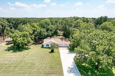 Aerial view of property and surrounding area with