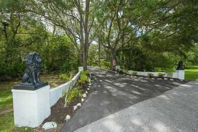 Drive up the winding circular driveway to your new