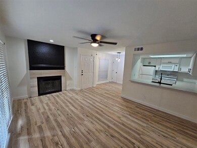 Unfurnished living room with wood finished floors,
