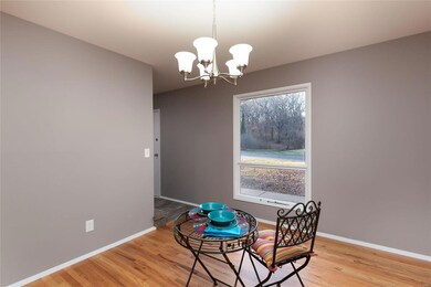 Entry also steps in to the Separate Dining Room, also with Gleaming Wood Floors and Light & Bright Window!