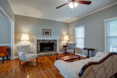 Notice the sand and finish wood floors!!  Wonderful wood burning fireplace.