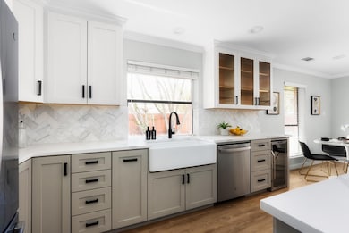 Kitchen with visible vents, ornamental molding, a