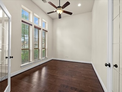 Office with french doors with views of front garden.