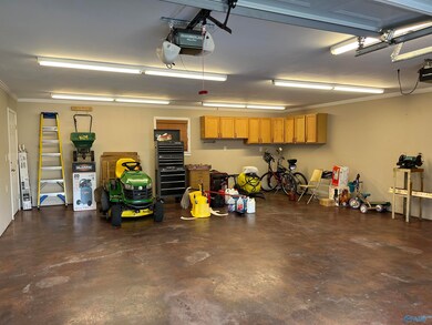 LOTS OF SPACE TO PARK THAT TRUCK OR BOAT! THERE ARE CABINETS ON THE BACK WALL FOR STORAGE!