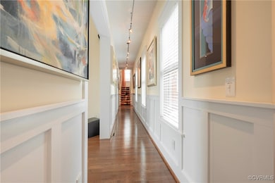 Art filled hallway w/ special lighting