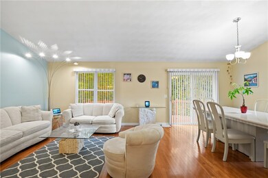 Living room / dining area with a slider to the bac