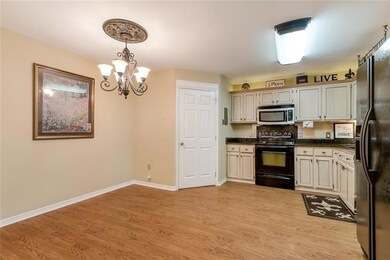 The kitchen flows from the living room.  Kitchen h
