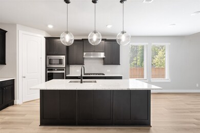 Enjoy an open concept kitchen for entertaining and