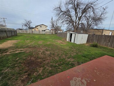 View of yard with a storage shed